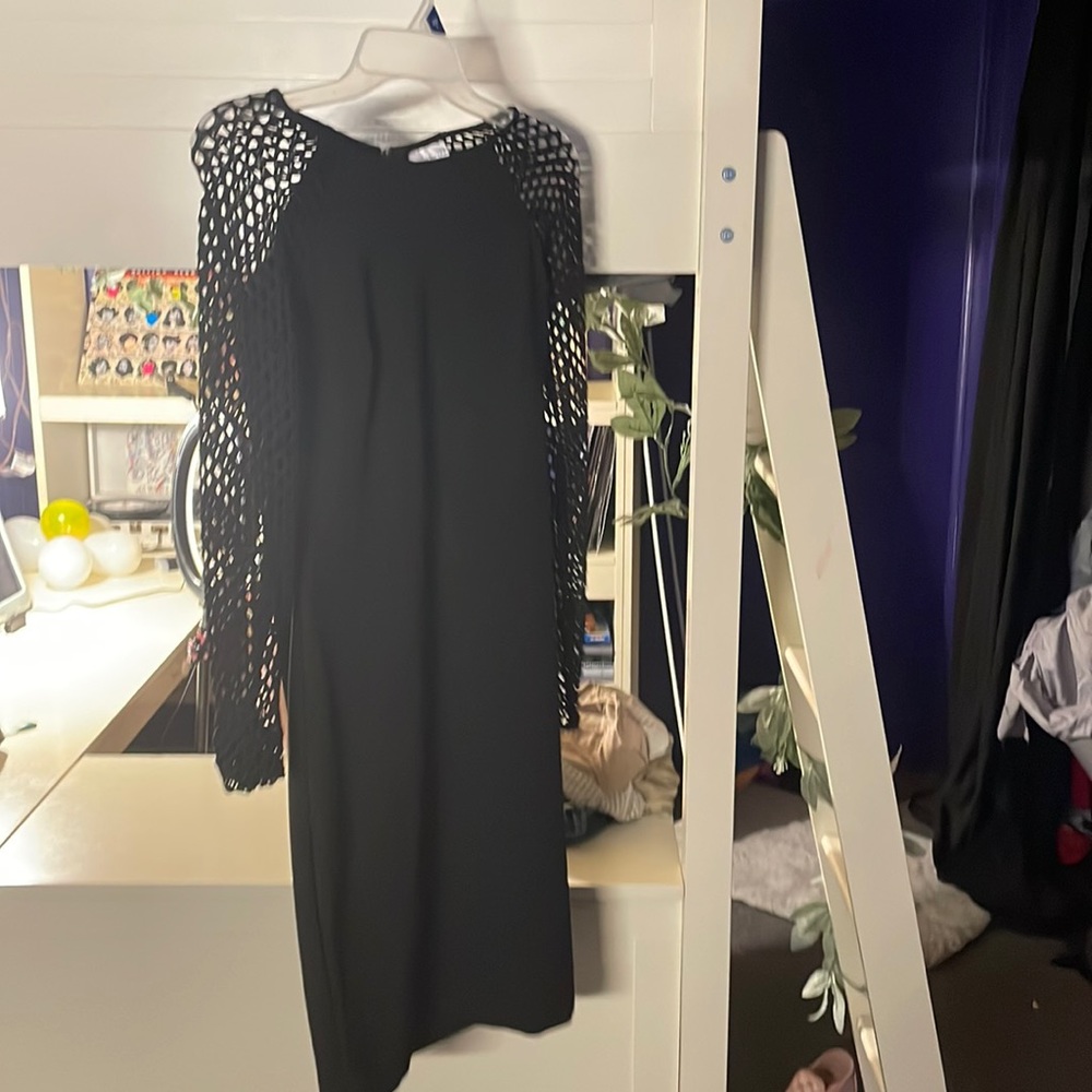 tight fit black dress with fishnets sleeves